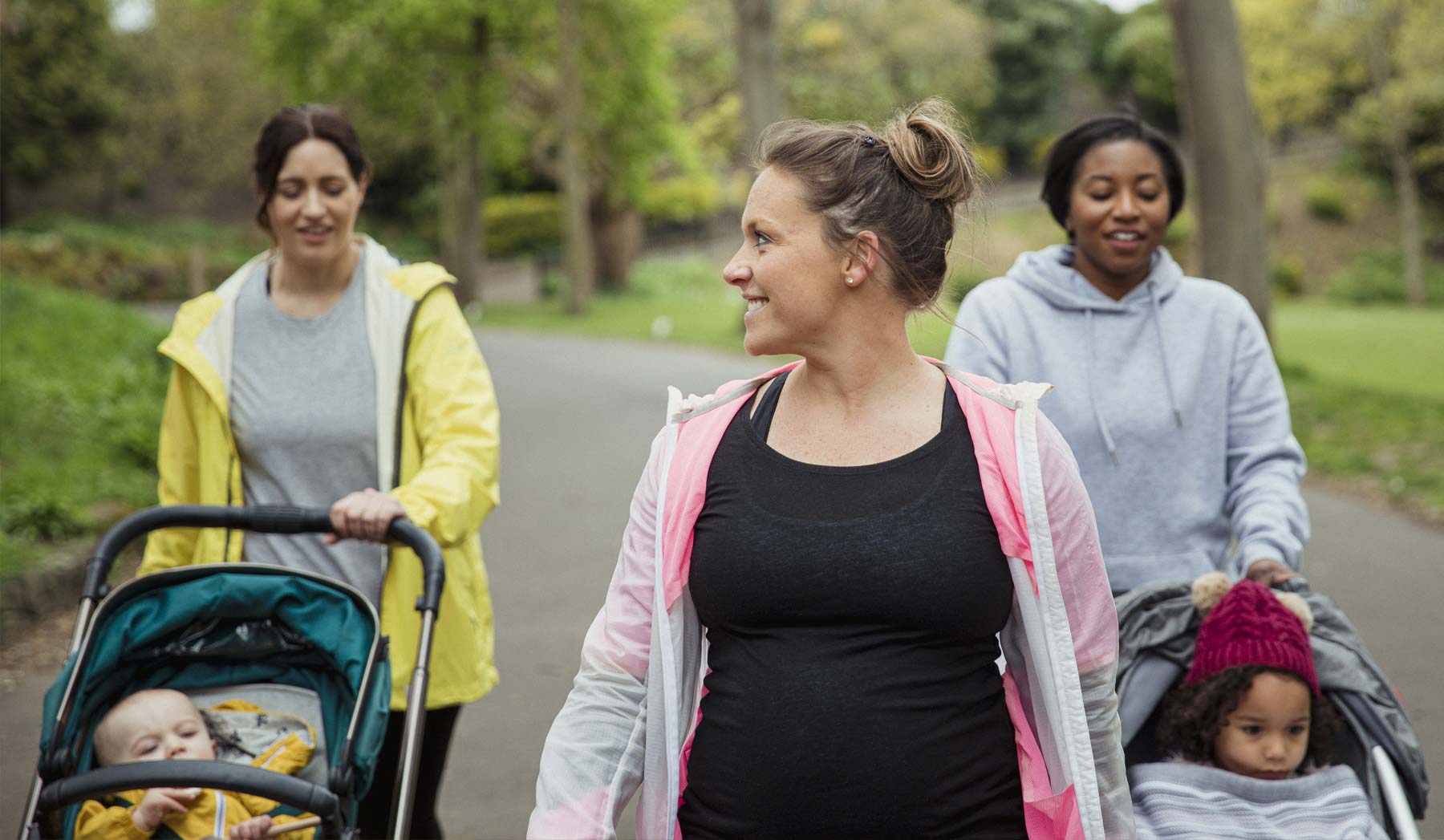 young moms walking babies with strollers